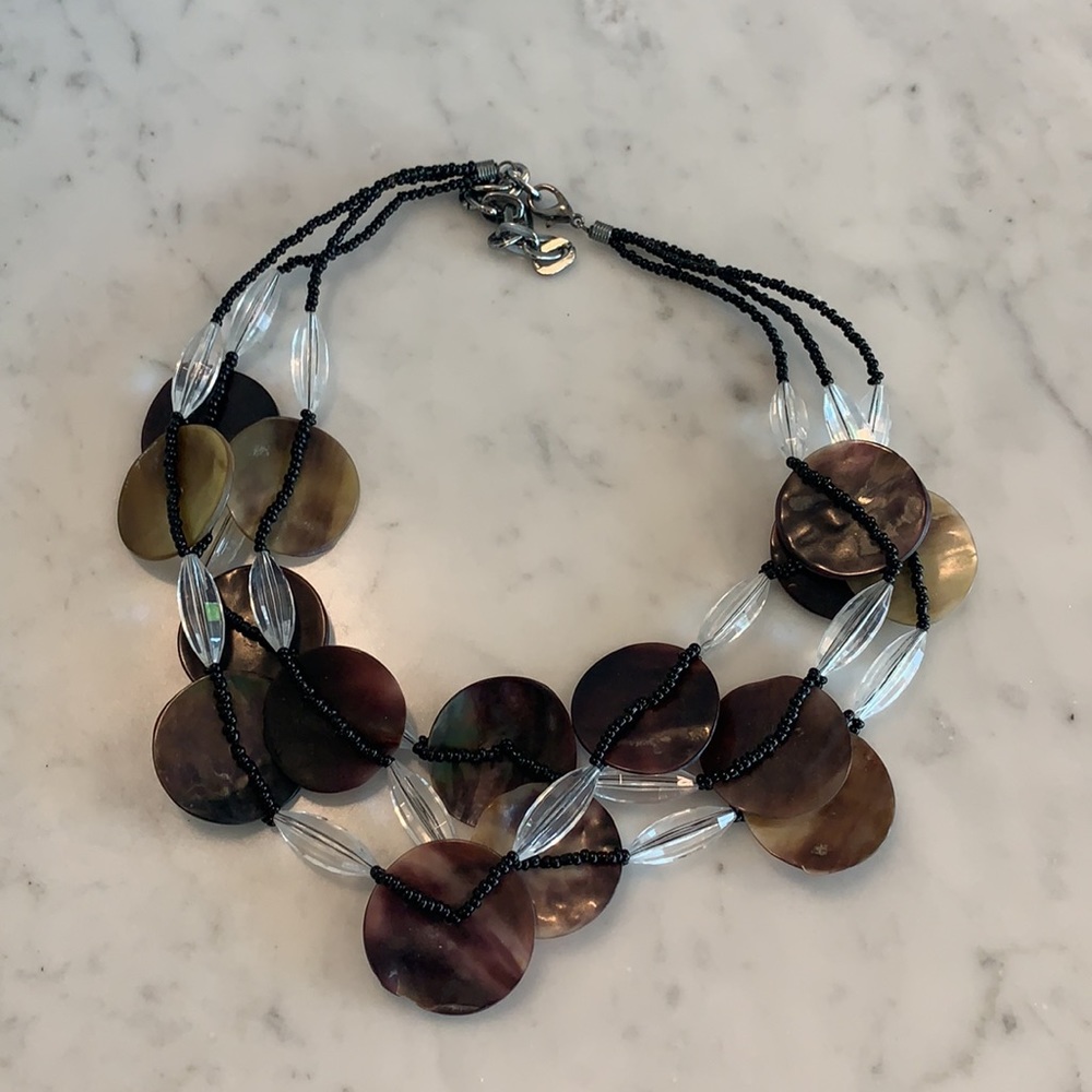 3 strand necklace with shells and clear beads.